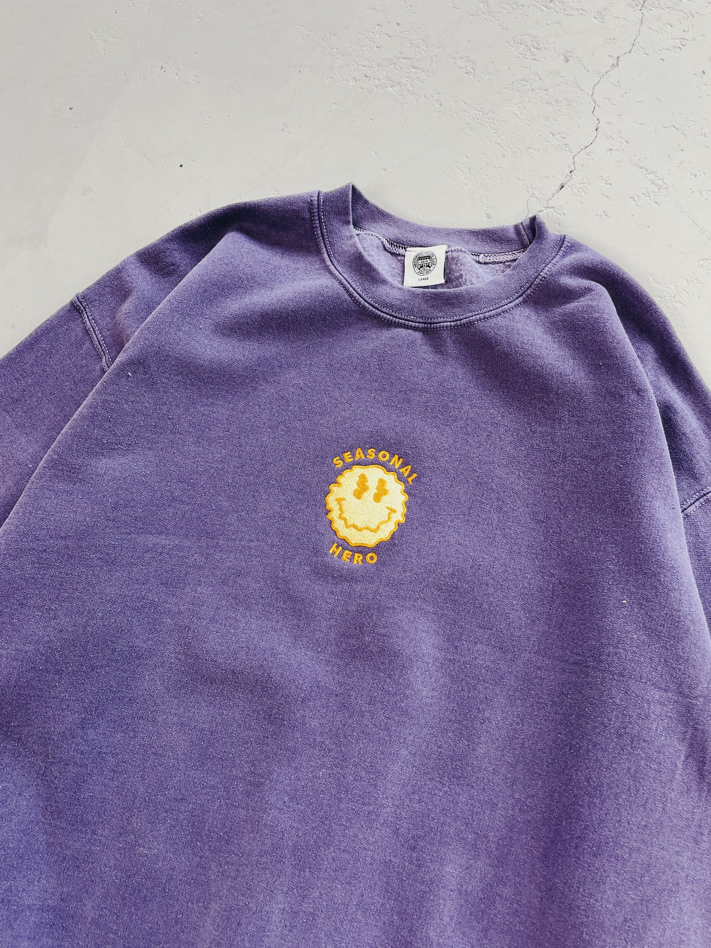 Seasonal Hero 'Trippy Smiler' Embroidered Vintage Washed Sweater - Violet