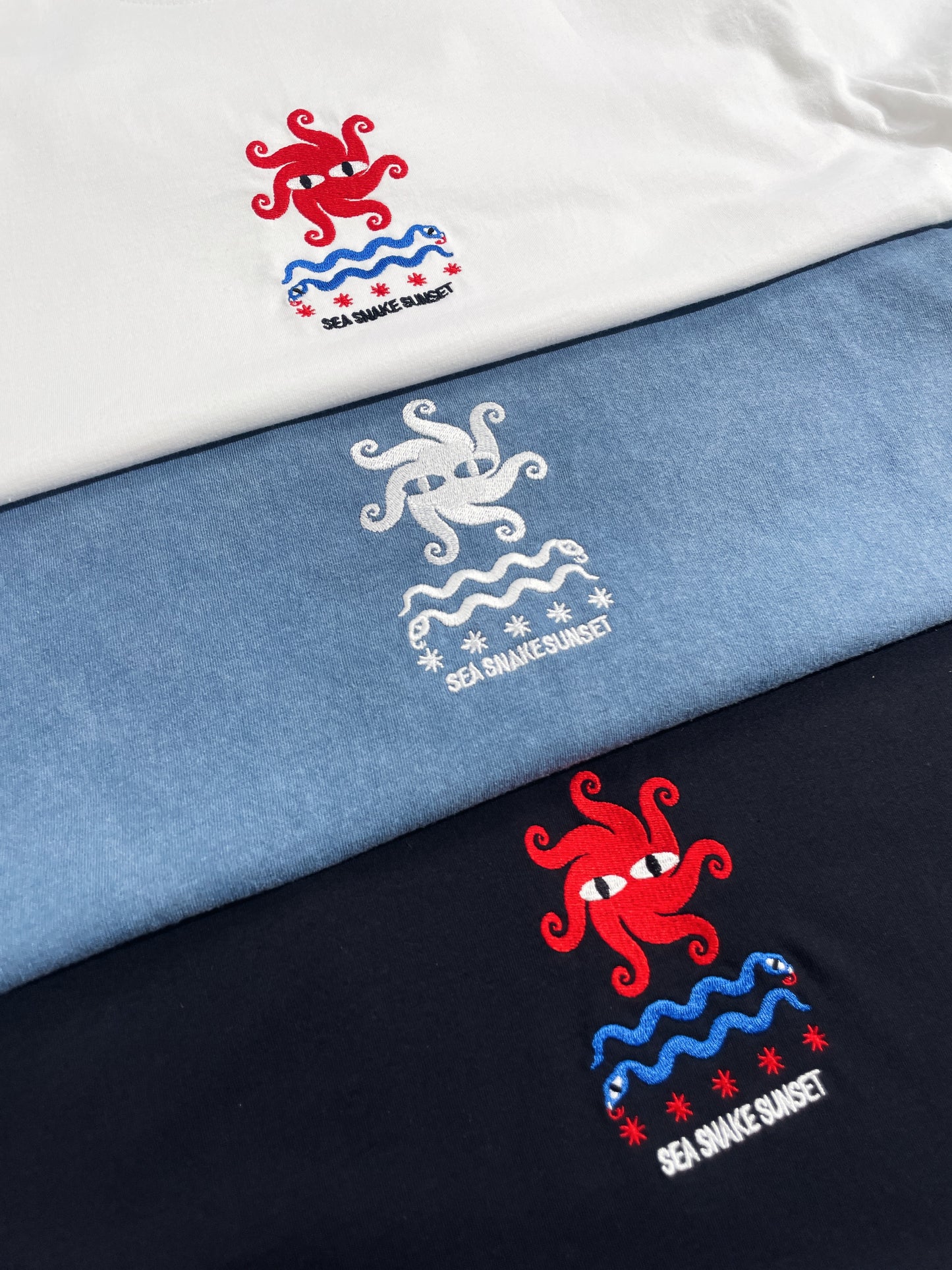 KBAR X UN:IK 'Sea Snake' Embroidered Tee - White